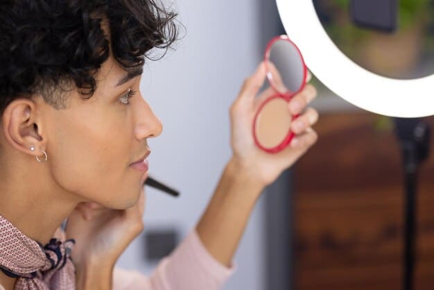 A man applying concealer to his face in front of a mirror, with a focus on the precision and ease of application. The lighting is bright and even, highlighting the product's coverage and natural finish.