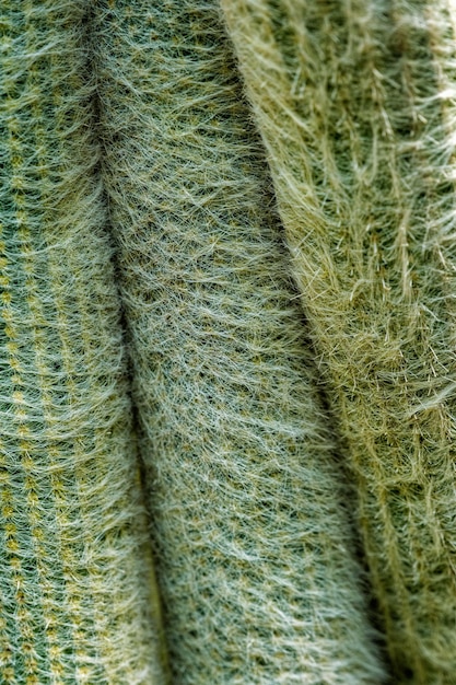 Close-up shot of various knitwear textures, including wool, cotton, and synthetic blends, showcasing the different patterns and weaves available in unisex knitwear.