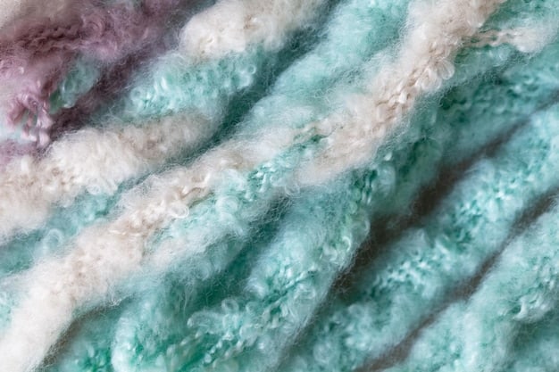 A close-up shot of fabric swatches in muted pastel colors, including lavender, mint green, dusty rose, and pale yellow. The fabrics have different textures like cotton, linen, and silk, showcasing the versatility of the color palette.