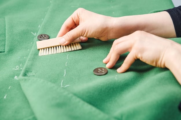 A close-up of a hand touching a textured, sustainable fabric used in a unisex jacket. The focus is on the material's quality and eco-friendly characteristics.