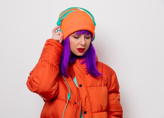 A person wearing a stylish unisex puffer jacket paired with a colorful scarf and beanie, showcasing how accessories can enhance the look.