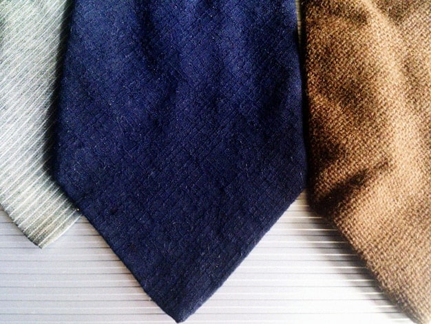 A close-up shot of different types of unisex pant fabrics, such as soft cotton, linen, and technical fabrics, highlighting their texture and comfort. The image should emphasize the quality and versatility of the materials.
