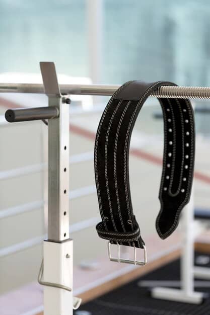 A close-up shot of various unisex belts displayed on a rotating carousel. The belts range in material (leather, canvas, metal), width, and buckle style. Each belt showcases fine craftsmanship and a unique design.