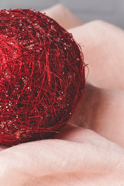 A close-up shot of various fabrics and textures, including soft knits, structured wool, and flowing silk, lying side-by-side, representing the diverse material choices available in non-binary fashion.