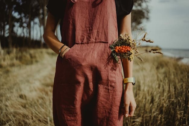 A person wearing wide-leg linen pants with a flowy peasant top, layered necklaces, and sandals. The look is bohemian and relaxed, with a focus on natural fabrics and textures.