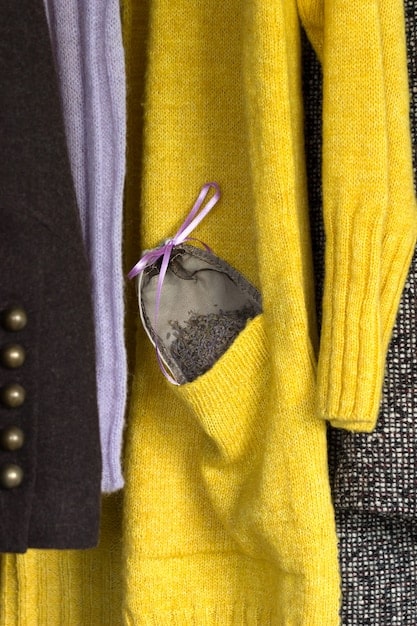 A close-up shot showcasing different types of comfortable and stylish clothing items suitable for non-binary individuals, such as oversized sweaters, wide-leg pants, and versatile accessories.