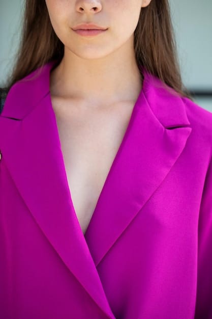 A close-up shot of a blazer's shoulder area, showing the seam sitting perfectly on the shoulder without any bunching or pulling.