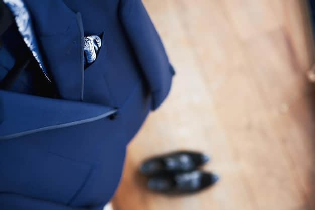 A collection of navy blue garments, including a wool coat, a button-down shirt, and tailored pants, neatly arranged to showcase the color's versatility.