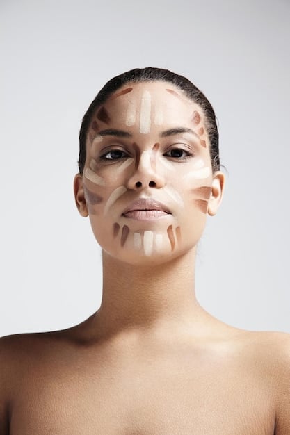 A person's face showing the contouring and highlighting process, with darker shades applied to the cheekbones and jawline, and lighter shades applied to the high points of the face.