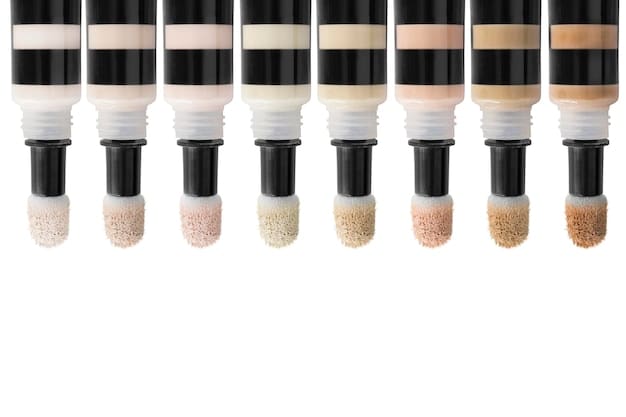 A diverse range of concealer shades arranged in a gradient, from fair to deep, with swatches on different skin tones to show how each shade blends. The lighting is even and bright to accurately represent the colors.