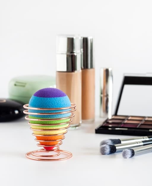A well-organized makeup kit for men, showcasing essential products like concealer, foundation, powder, brushes, and a blending sponge. The background is simple and clean to highlight the makeup items.