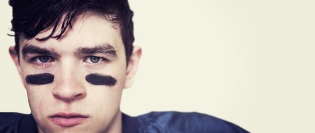 A split image demonstrating the tightlining technique. On one side, a man's eye before tightlining, and on the other side, the same eye with the upper waterline lined for subtle enhancement.