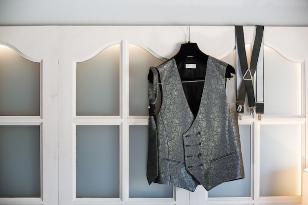 A close-up shot of various androgynous clothing items on a rack, including a blazer, button-down shirt, wide-leg trousers, and a neutral-colored sweater. The focus is on the textures and cuts of the garments, conveying the essential elements of an androgynous wardrobe.