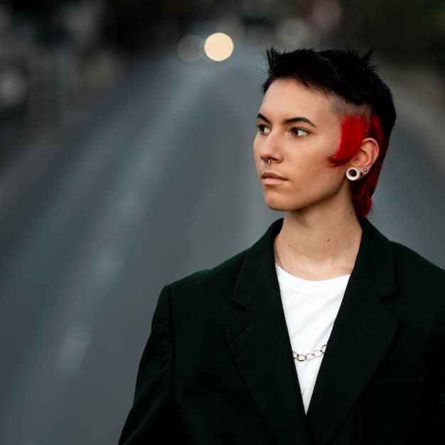 A person wearing a suit with bold makeup, defying gendered fashion norms and embracing androgynous style.