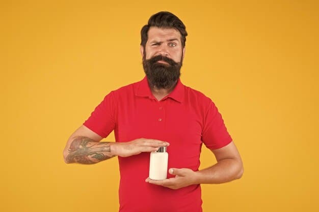 A person holding a newly purchased, fresh bottle of beard oil next to an older, discolored bottle, clearly showing the contrast in appearance.