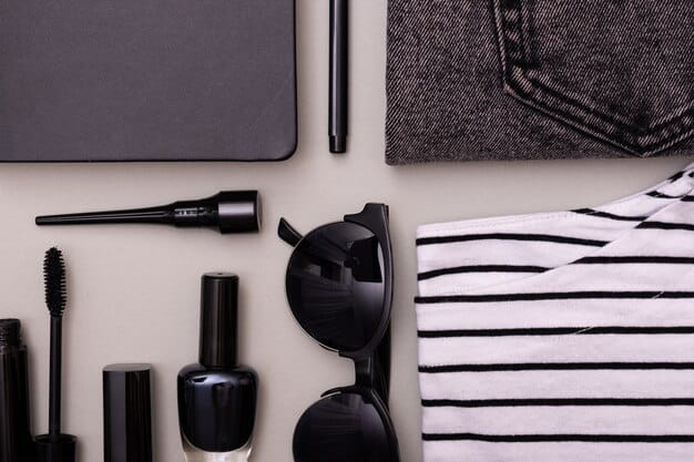 A selection of men's grooming products, including various types of eyeliners, a primer, and setting spray, neatly arranged on a clean, minimalist surface.