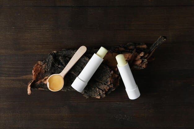 A detailed flat lay of various men's lip care products, including an SPF lip balm, a lip scrub, and a hydrating lip treatment, arranged neatly on a dark, textured background.