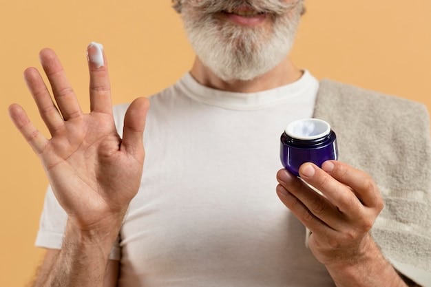 A detailed close-up of a man's hand dispensing a modest amount of white cream from a dark bottle onto his fingertips, highlighting the product texture.