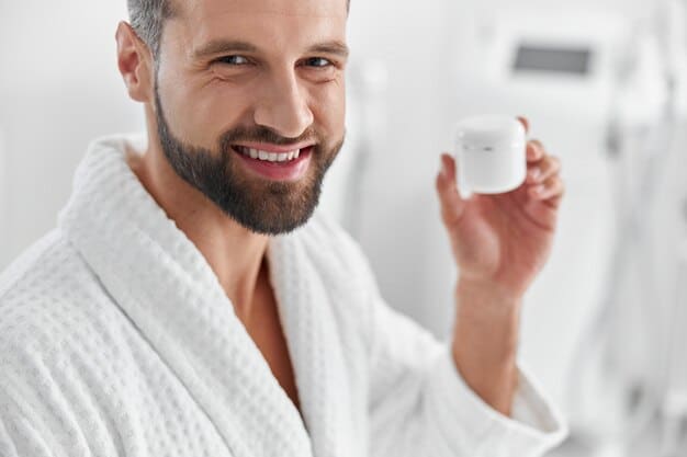 A man with a clean, hydrated face gently applying a lightweight facial moisturizer. The background is a clean, modern bathroom.