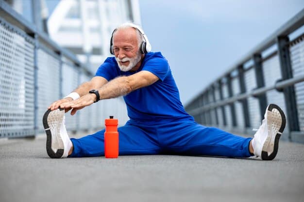 A muscular man in his 50s performing a light stretch or warm-up exercise, showing flexibility and vitality, with a focus on ease of movement rather than strenuous activity.
