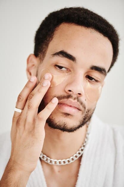 A close-up of a man's face, showcasing a natural, healthy glow on his skin after applying a luminous foundation, with good skin texture still visible.