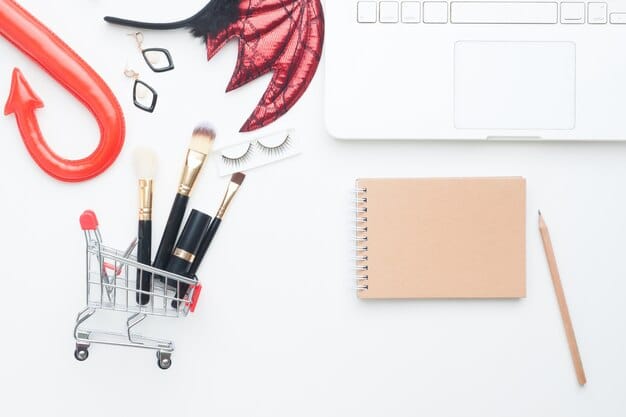 A neatly organized flat lay of a men's makeup subscription box, showing various product tubes, brushes, and a small information card, set against a minimalist background.