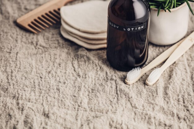A stylish, minimalist bathroom counter with bottles of beard oils, a comb, and a small plant, conveying a sense of modern grooming.
