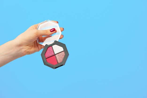 A dynamic shot of a person's hand holding a single, well-used but clean, affordable makeup brush, poised above a clean, minimalist vanity. The lighting is bright and functional, emphasizing practicality.