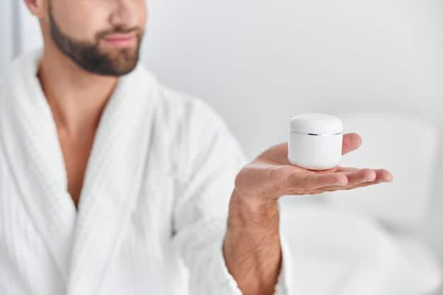 A minimalist male skincare routine set with advanced product bottles and a digital device showing a personalized skin health report.