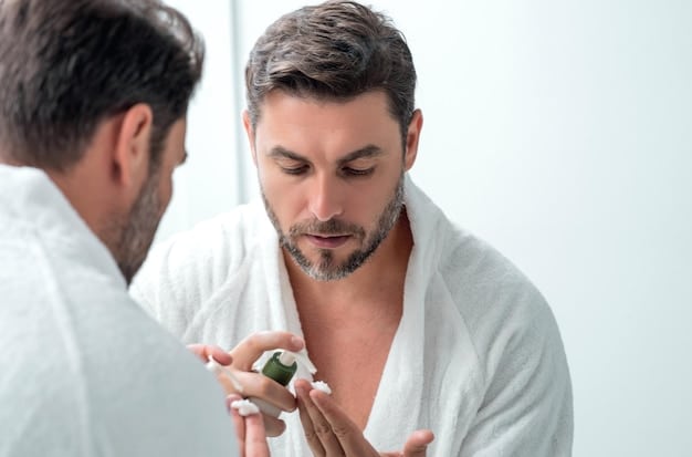 A man gently applying a face scrub, with a focus on his hand and the product on his skin, conveying a sense of careful application and product texture. The background is a clean, modern bathroom setting.