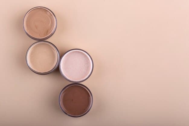 A flat lay of three different men's concealers (stick, liquid, pot) on a minimalist grey background, with a small focus on their texture swatched on a skin-toned surface, illustrating different finishes and applications.