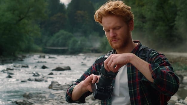 A man wearing a casual flannel shirt with a robust field watch on his wrist, showcasing its rugged appeal in an outdoor setting.