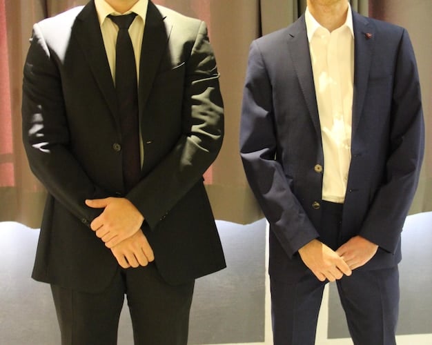A side-by-side comparison of a silk suit and a velvet blazer. The silk suit should be a light, shimmering color, while the velvet blazer should be a deep, rich tone like burgundy or navy. The composition aims to highlight the elegance and textural differences of each fabric, illustrating how to choose the right suit fabric for every season in 2025 for special occasions.