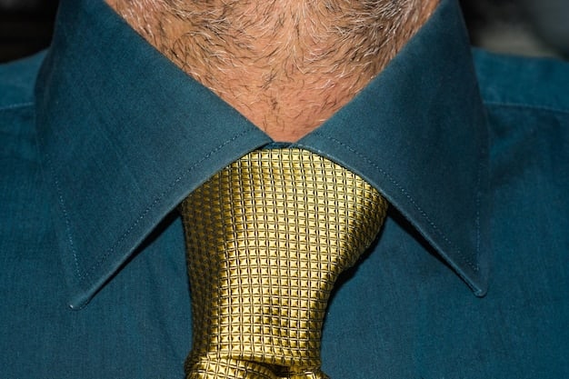 A close-up shot of a man's blazer pocket showcasing a brightly colored and intricately patterned pocket square, emphasizing how it can add personality and flair and demonstrating the power of accessories: 6 ways to elevate your men's style instantly.