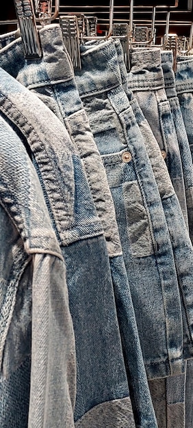 A close-up shot of different denim fabrics showcasing various textures and washes, including raw denim, selvedge denim, and stonewashed denim. The image highlights the diversity of denim materials related to 'The Ultimate Guide to Men's Denim: Styles, Washes, and Fits'.