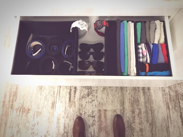 A close-up shot of a neatly organized men's closet, featuring key wardrobe essentials such as a white dress shirt, dark wash jeans, a navy blazer, and neutral chinos, neatly folded or hung, emphasizing quality and versatility for Men's Style on a Budget.