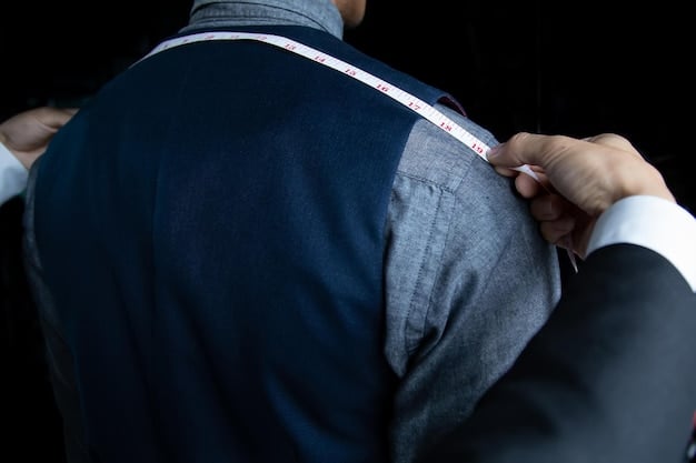 A tailor working on a suit jacket, adjusting the fit around the shoulders. The focus is on the tailor's hands and the precision of their work, emphasizing the importance of proper fit and tailoring in achieving a polished and stylish look. This imagery supports the idea of prioritizing proper fit and tailoring as part of the 5 Men's Style Resolutions to Make in 2025.