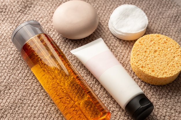 A close-up of various skincare products designed for oily skin, including a cleanser, toner, and moisturizer. The products are arranged on a clean, white surface with a soft, natural light. Products containing salicylic acid or benzoyl peroxide are highlighted.