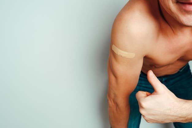A close-up of a transdermal patch being applied to a man's forearm. The patch is small and transparent, seamlessly blending into the skin. The man's skin appears healthy and well-maintained. The image represents the advanced delivery systems in men's skincare, highlighting the latest in men's skincare: new ingredients and technologies in 2025.