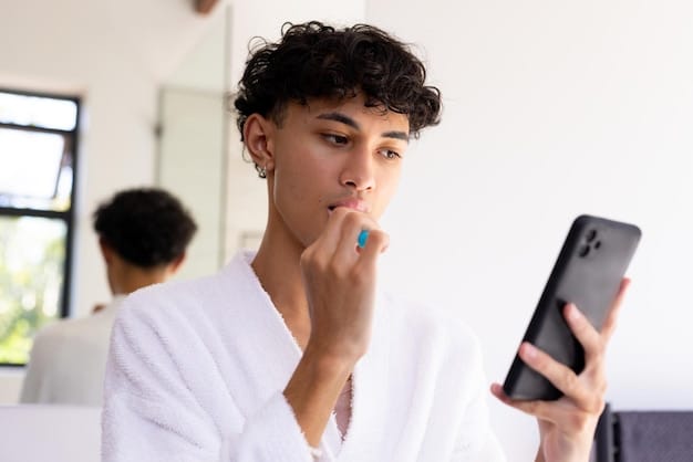 A man using a personalized skincare device, highlighting the incorporation of technology in skincare routines. The setting is a modern bathroom with soft lighting, subtly showcasing the device and the man's focused expression.