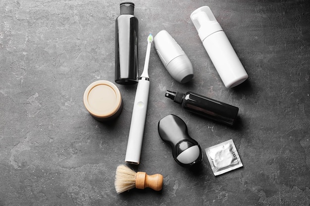 A selection of men's makeup products laid out on a clean surface, including concealer sticks, BB creams, lip balms, and eyebrow gels. The products are from various brands and cater to different skin tones. The image showcases the variety and range of options available in the men's makeup market, reflecting the trend of Is Genderless Beauty Here to Stay? Analyzing the Impact on Men's Makeup Trends.