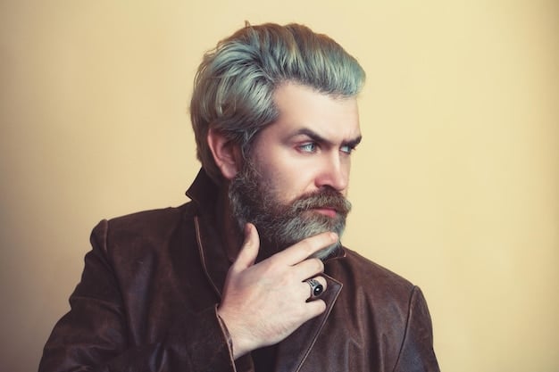 A close-up of a man's hair styled in a textured quiff, featuring a vibrant streak of electric blue that contrasts sharply with his dark natural hair color. This showcases a bold and modern take on Men's Hair Color Trends: What Shades Will Be Popular in the Coming Year?.