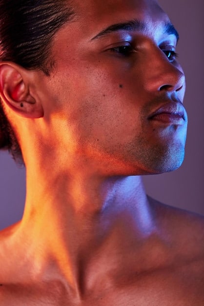 A male model with subtly contoured cheekbones and a healthy, bronzed glow, demonstrating natural facial definition without heavy makeup, conveying an aura of subtle sophistication.